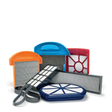 A collection of filters and other vacuum cleaner parts.